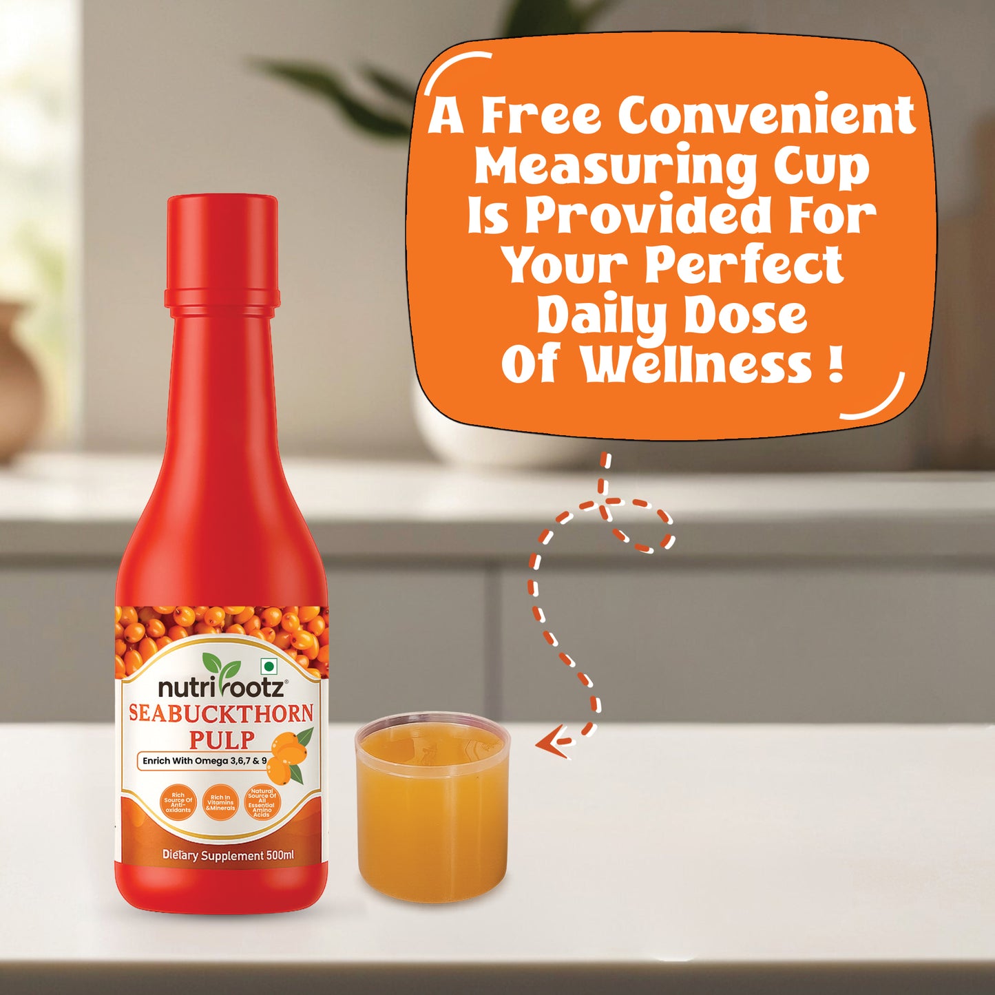 A red bottle of nutrirootz Seabuckthorn Pulp dietary supplement stands on a white countertop next to a small clear measuring cup filled with orange liquid. A large orange promotional text bubble appears above, reading 'A Free Convenient Measuring Cup Is Provided For Your Perfect Daily Dose Of Wellness!'.